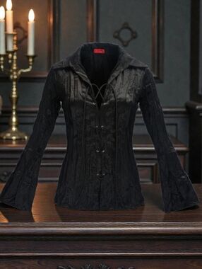 C'est Moi black blouse with bell sleeves and a lace-up front